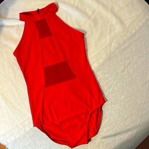 Honeycut high neck red leotard with red mesh cutout. Zipper back. Smokefree home